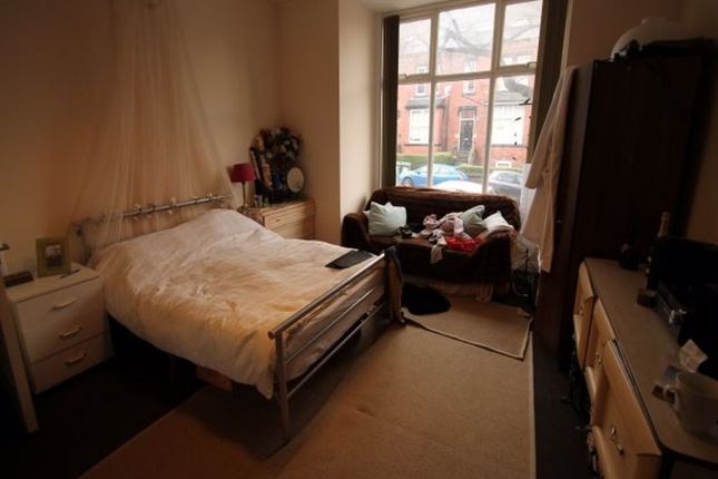 A Spacious And Inviting Master Bedroom With A Larg...