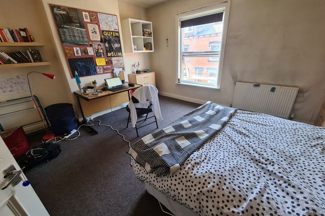 Cozy Single Bedroom Featuring A Comfortable Bed, A...