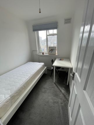 Bright And Tidy Single Bedroom Featuring A Comfort...