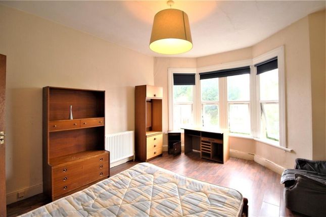 A Spacious Master Bedroom Featuring A Large Bay Wi...