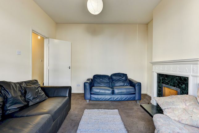 A Spacious And Well-Maintained Living Room Featuri...