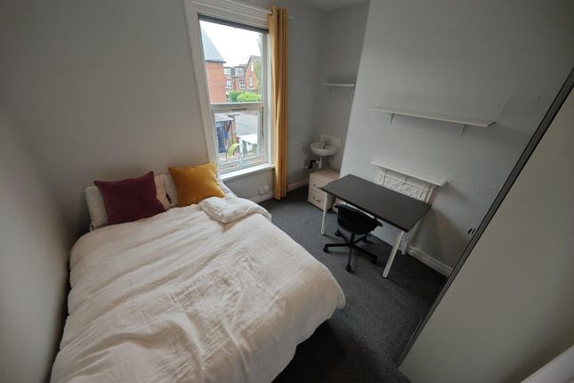 A Cozy Double Bedroom Featuring A Comfortable Bed ...