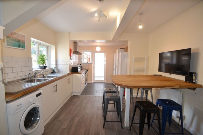 Bright And Spacious Kitchen Featuring Modern Appli...