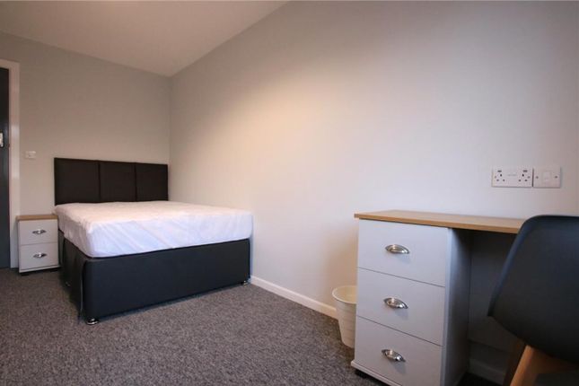 A Spacious And Tidy Double Bedroom Featuring A Com...