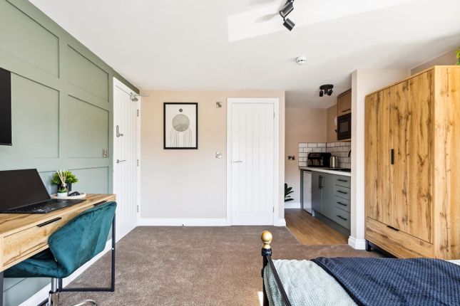 This Charming Double Bedroom Features A Cozy Layou...