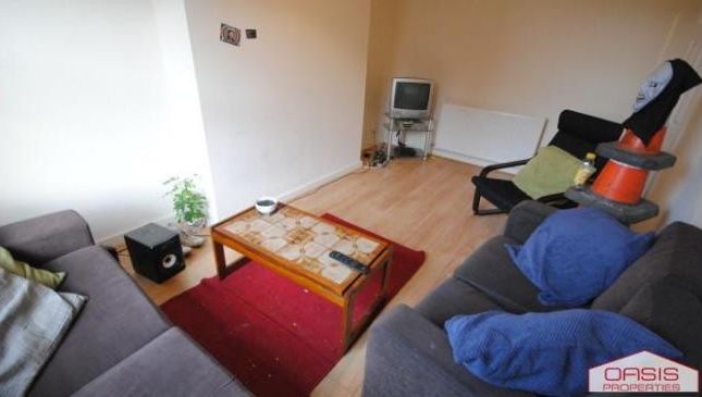 Bright And Welcoming Living Room Featuring Comfort...