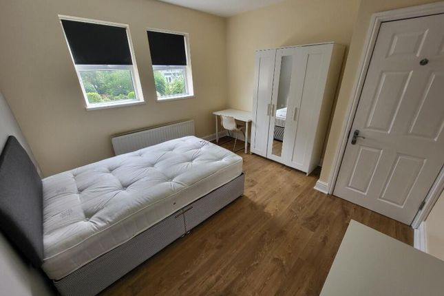 This Inviting Double Bedroom Features Ample Natura...