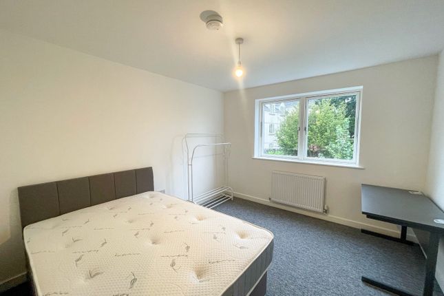 This Spacious Double Bedroom Features A Comfortabl...