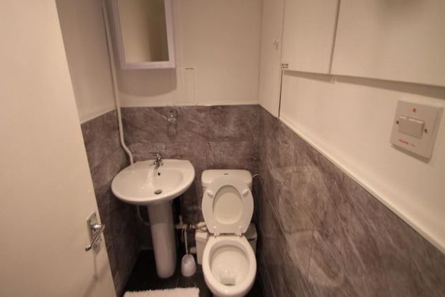 A Clean And Functional Small Bathroom Featuring A ...