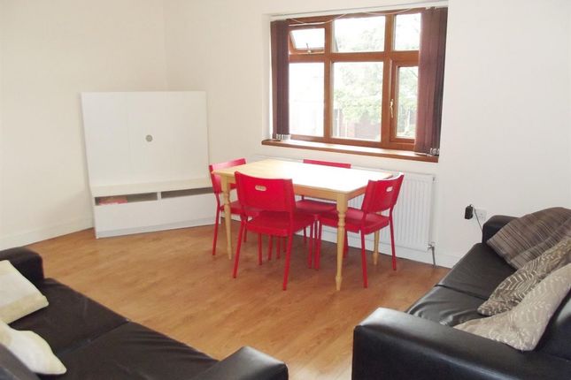 A Bright And Spacious Living Room With Large Windo...