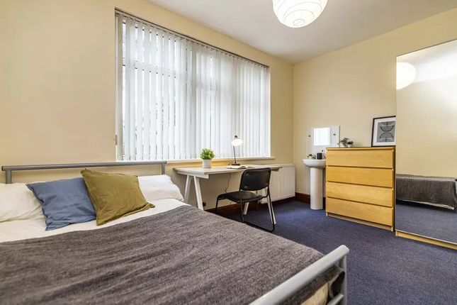 A Cozy Double Bedroom Featuring A Comfortable Bed ...