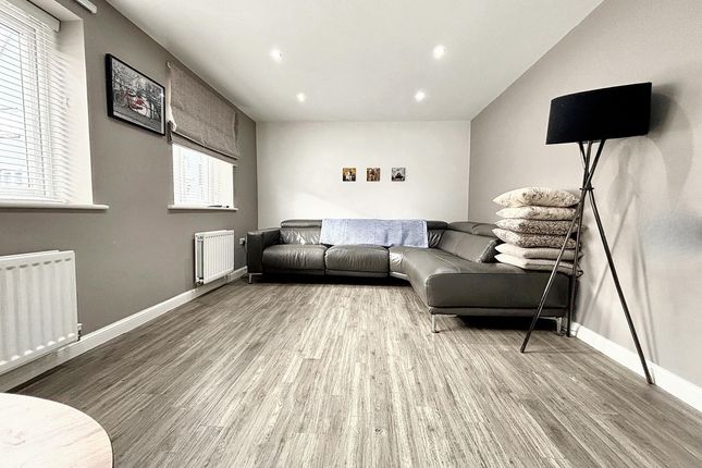 Bright, Modern Living Room With A Large L-Shaped S...