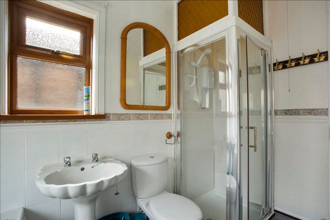 Bright And Modern Bathroom Featuring A Stylish Sho...