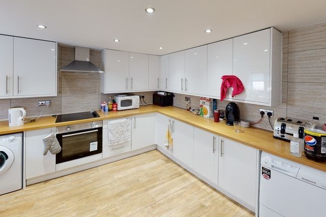 Bright And Modern Kitchen With Ample Cabinetry And...