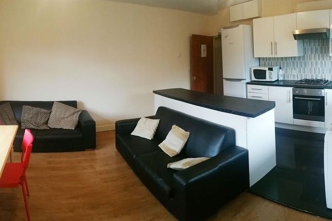 A Modern And Spacious Living Room Featuring Contem...