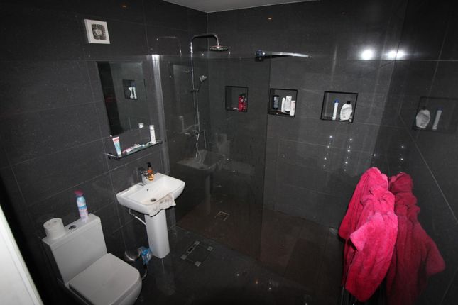 Modern Tiled Bathroom With A Walk-In Double Shower...