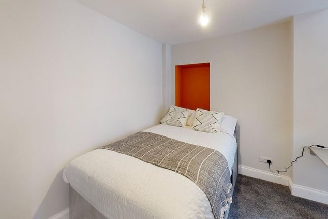 A Cozy And Inviting Double Bedroom With Tasteful d...