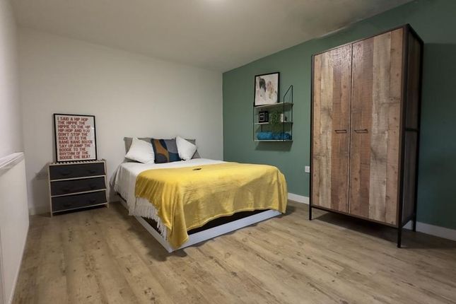 A Tidy And Modern Double Bedroom Featuring A Comfo...