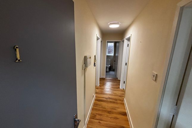A Bright, Clean Bathroom With A Toilet And Window,...