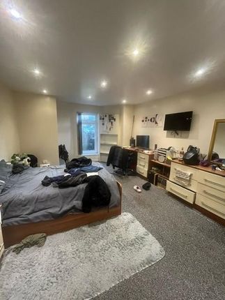 Spacious And Inviting Living Room Featuring Modern...