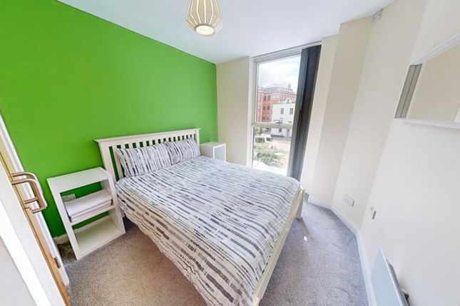 Bright Single Bedroom With A Fresh Green Accent Wa...
