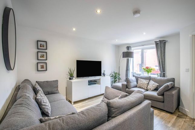A Bright And Cozy Living Room Featuring Ample Seat...