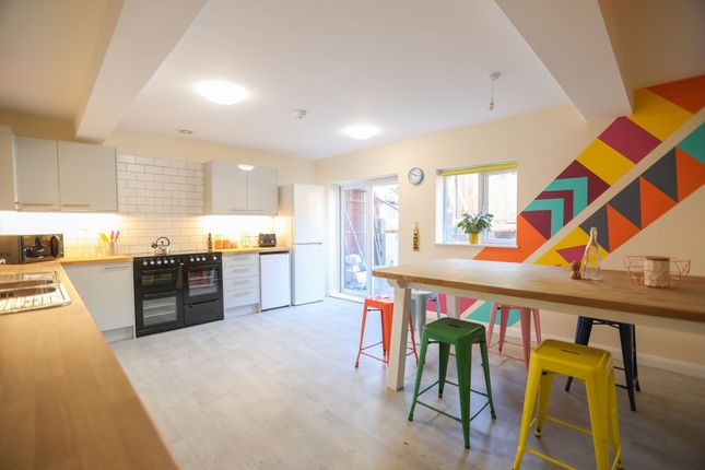 This Vibrant Kitchen Features A Spacious Layout Wi...
