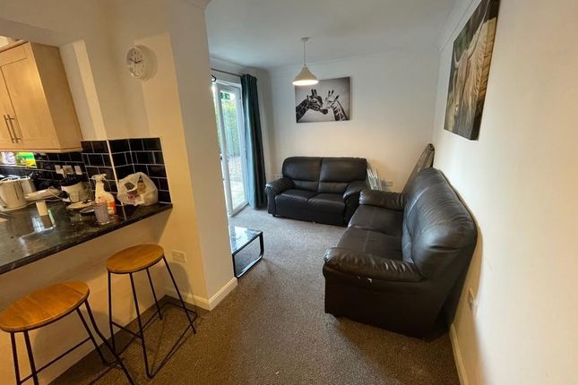 A Modern And Inviting Living Room Featuring A Comf...