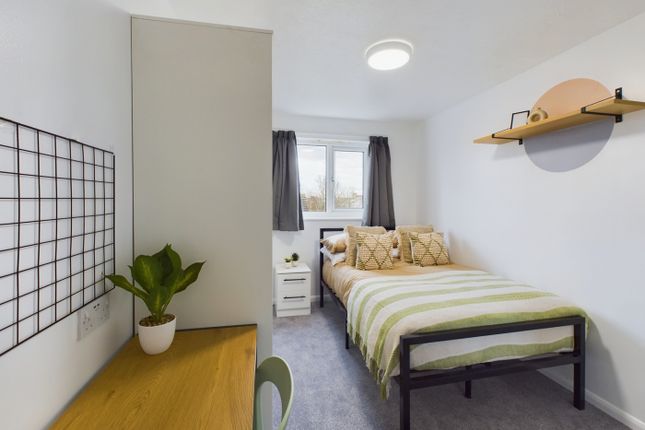 A Bright And Inviting Double Bedroom With Modern d...