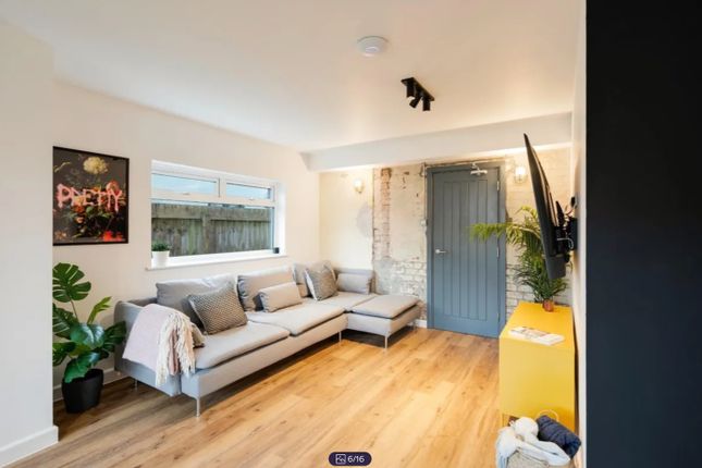 A Spacious And Stylish Modern Living Room Featurin...