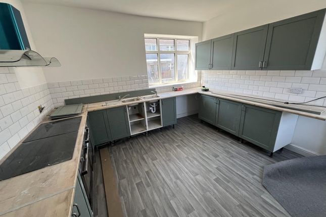 Bright And Spacious Kitchen Featuring Modern Cabin...