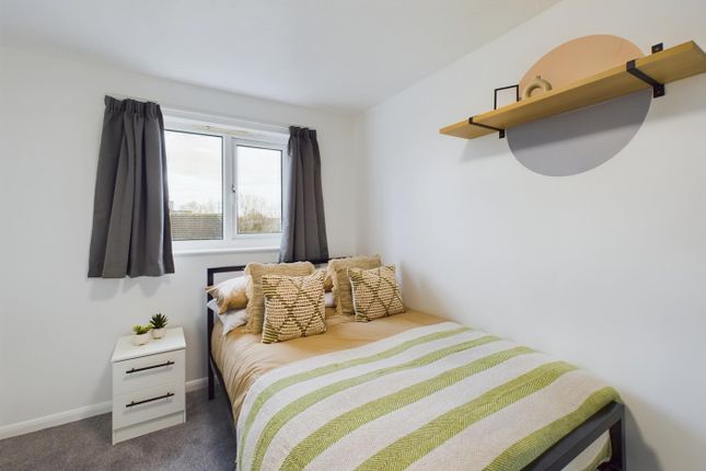 A Bright And Inviting Double Bedroom Featuring A c...