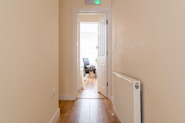 Bright And Well-Maintained Hallway Leading To A We...