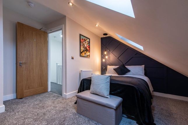 Experience A Stylish Double Bedroom Featuring Mode...