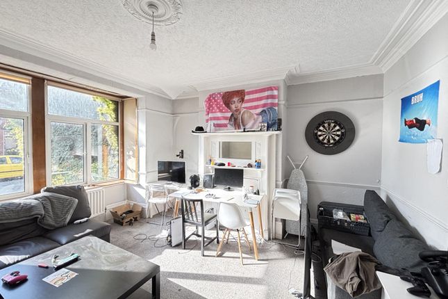 Bright And Welcoming Living Room With Large Window...