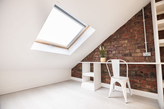 Bright Loft Bedroom With A Large Skylight, Exposed...