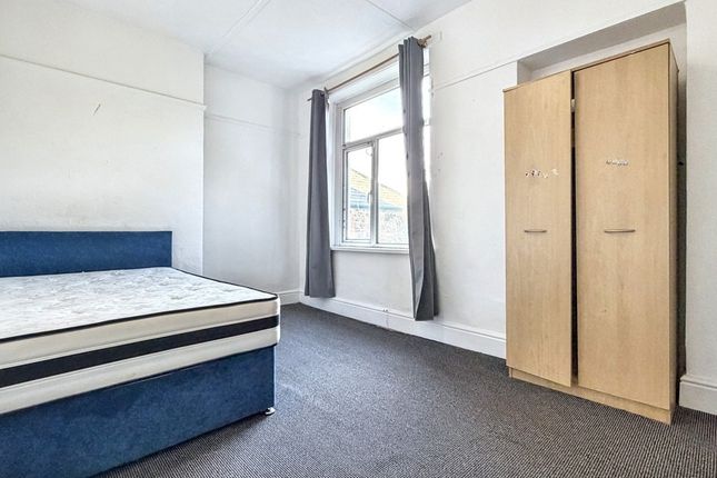 Bright, Simply Furnished Bedroom With A Comfortabl...