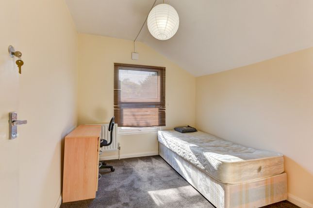 A Simple Single Bedroom With A Comfortable Bed, A ...