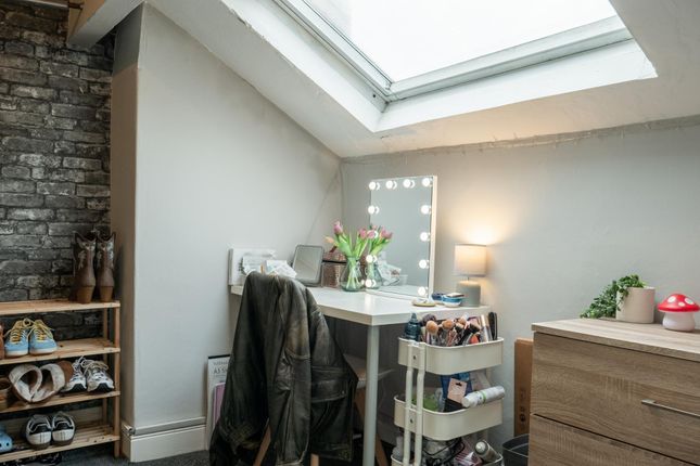 A Bright And Tidy Bedroom Featuring A Large Skylig...