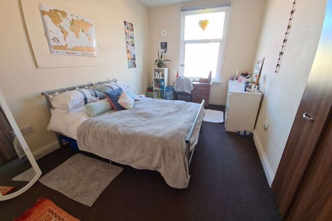 A Bright And Inviting Master Bedroom Featuring A c...