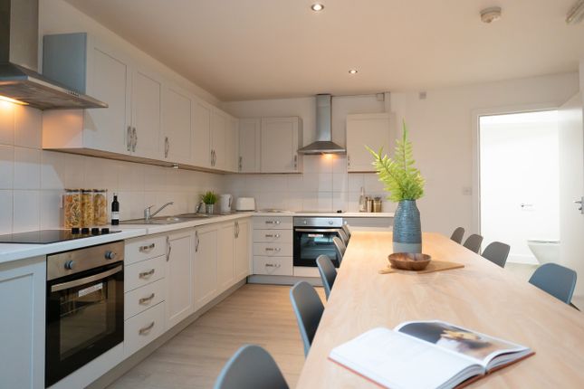 A Bright And Modern Kitchen With Ample Space For c...