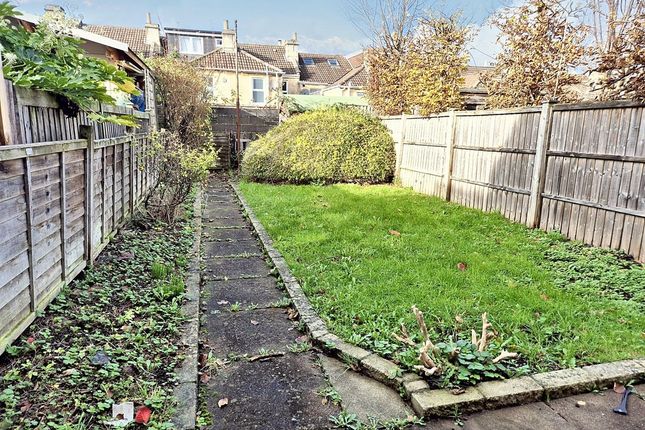 Private Rear Garden With A Paved Path Leading To A...
