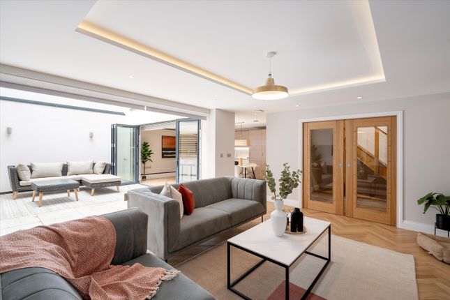 Terraced house for sale in Rowley Mews, Addison Bridge Place, London W14.