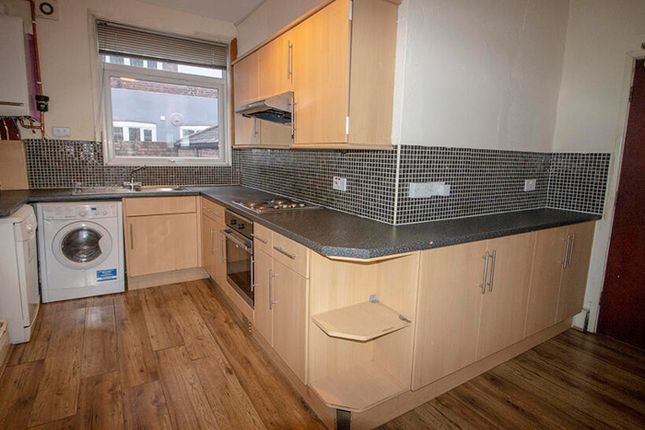 This Modern Kitchen Features Sleek Cabinetry And A...