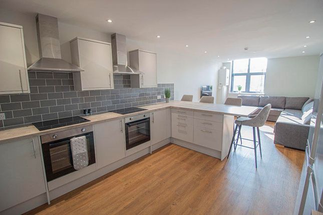 Modern Kitchen Featuring Sleek Cabinetry, Ample Co...