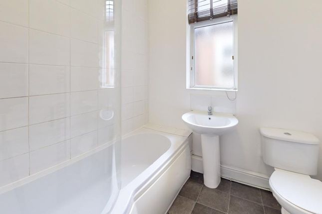 A Bright And Clean Bathroom Featuring Modern Fixtu...