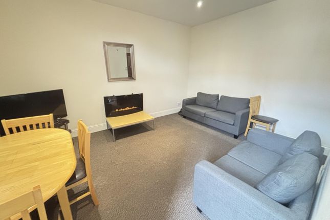 A Spacious, Well-Maintained Living Room Featuring ...