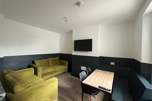 A Modern And Inviting Living Room With Comfortable...