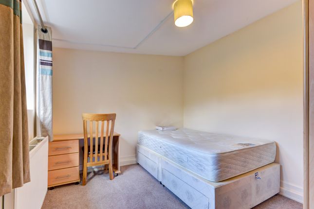 A Cozy And Neat Single Bedroom Featuring A Comfort...