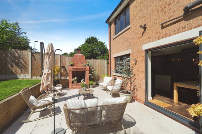 Garden With Feature Fire, Multiple Seating Areas And Wow